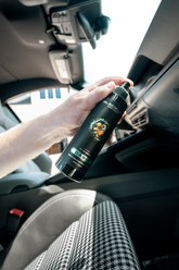 Blackline Car Care BLACKLINE 8oz air freshener spray for cars, featuring a sleek black bottle with Oasis scent label.