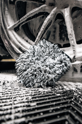 Close-up of Blackline Car Care BLACKLINE® microfiber wheel mitt showing soft, dense microfiber material for effective car wheel cleaning.