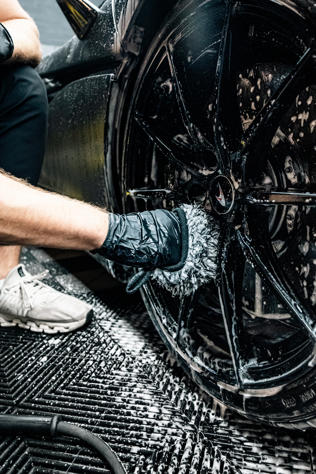 Blackline Car Care BLACKLINE® microfiber wheel mitt in use, designed for cleaning car wheels with soft, durable microfiber material.