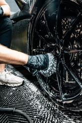 Blackline Car Care BLACKLINE® microfiber wheel mitt in use, designed for cleaning car wheels with soft, durable microfiber material.