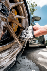 Blackline Car Care BLACKLINE® microfiber wheel mitt in use, showing soft, plush material for cleaning car wheels effectively