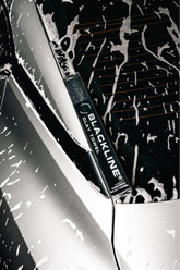 Blackline Synthetic Clay Towel in black case, designed for car detailing and paint surface cleaning.