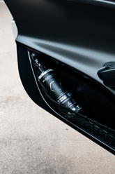 Blackline Car Care BLACKLINE® RESET interior cleaner and scent booster applied to a car door panel for fresh, clean interior.