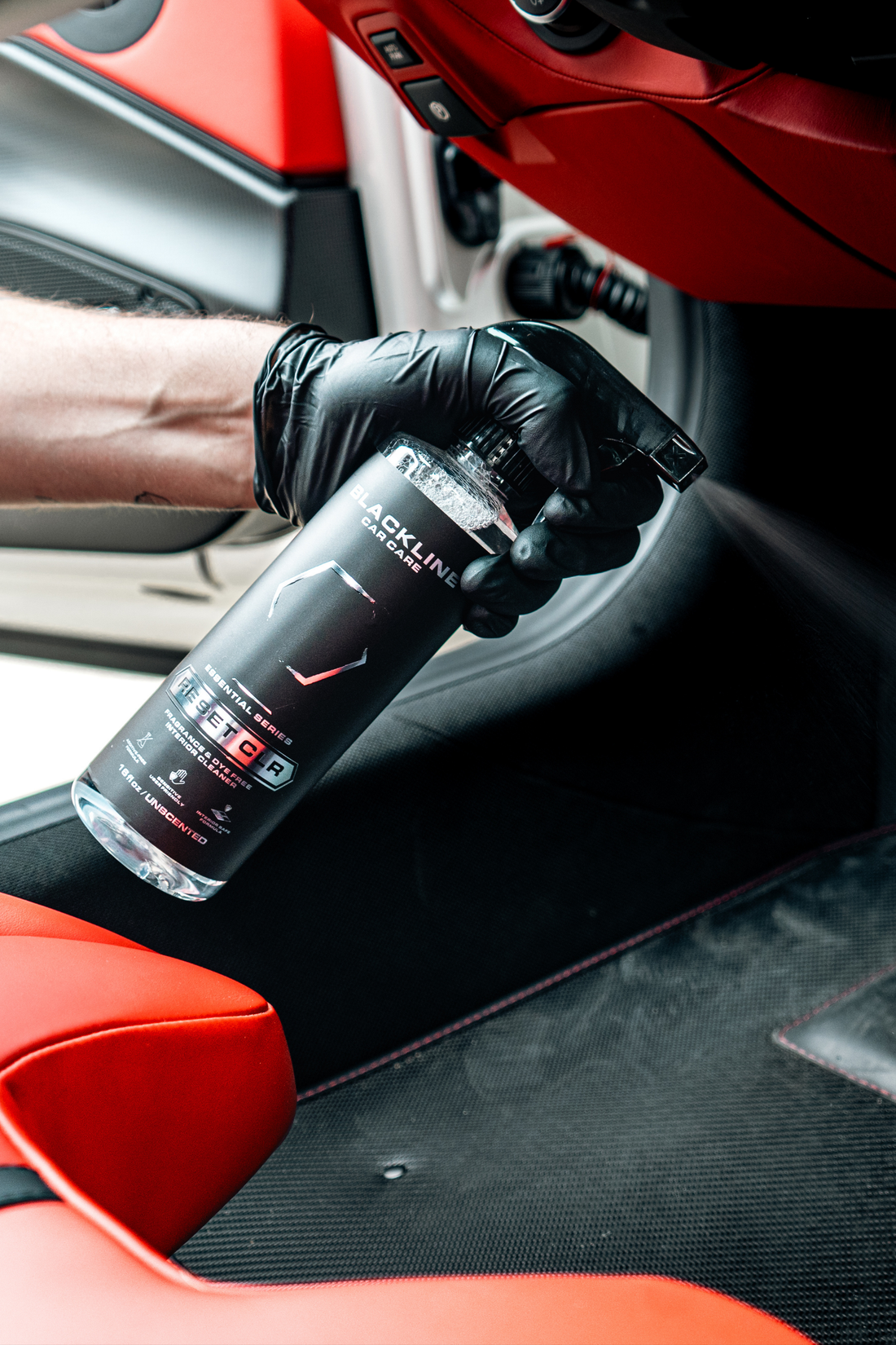 Blackline Car Care BLACKLINE® RESET interior cleaner and scent booster spray with nozzle, ready for use in car interior cleaning.
