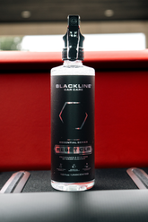 Blackline Car Care BLACKLINE® RESET interior cleaner and scent booster bottle with label and spray nozzle.