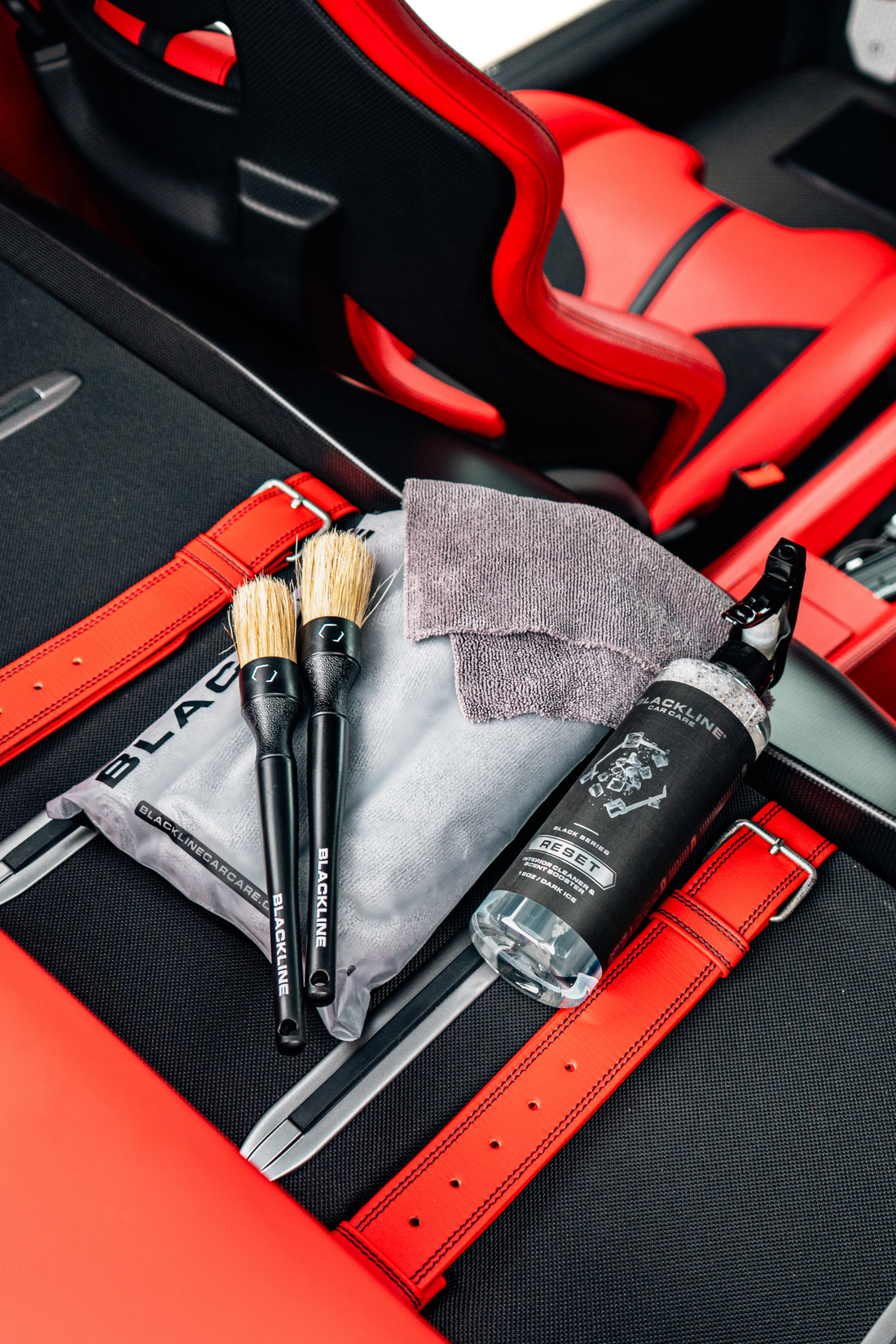 Blackline Car Care BLACKLINE® RESET interior cleaner and scent booster in dark ice scent inside a Ferrari F12 trunk