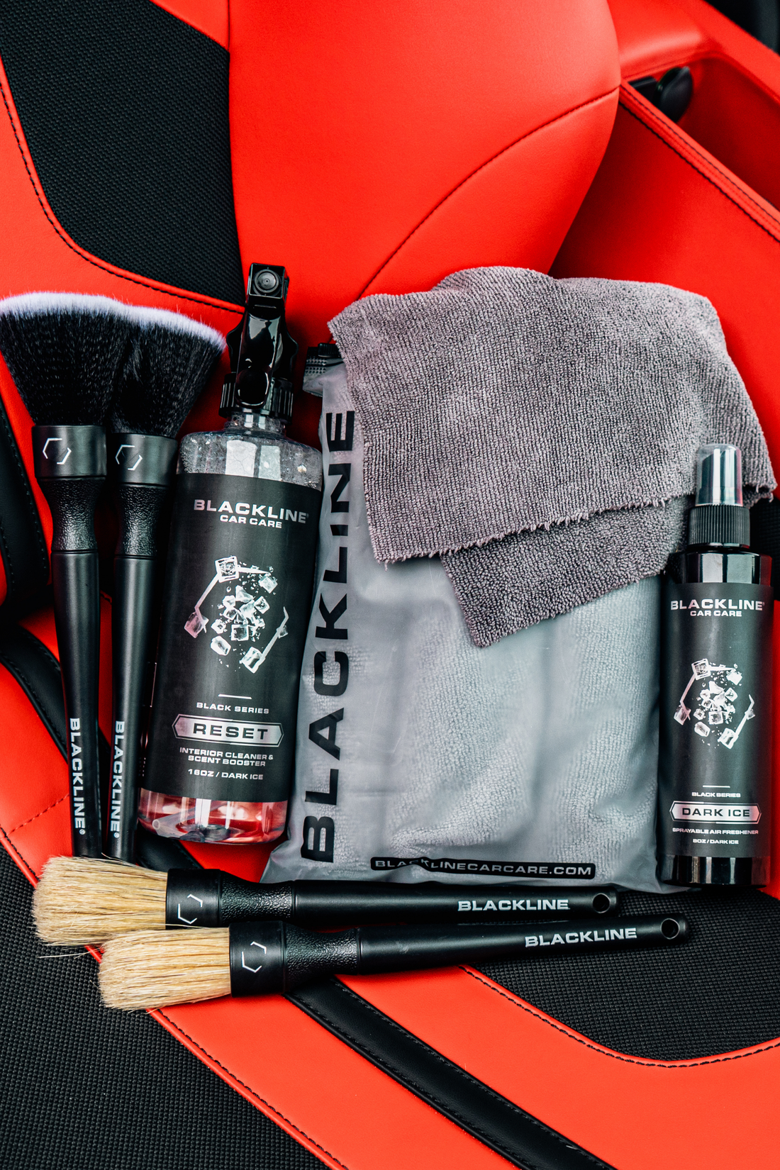 Blackline Car Care BLACKLINE® RESET interior cleaner and scent booster in a Ferrari F12 seat, showcasing a dark ice scent experience.