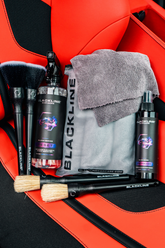 Blackline Car Care BLACKLINE® RESET interior cleaner and scent booster in a Ferrari F12 seat, showcasing vehicle interior cleaning products.