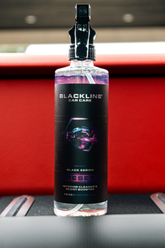 Blackline Car Care BLACKLINE® RESET interior cleaner and scent booster bottle with label detail.