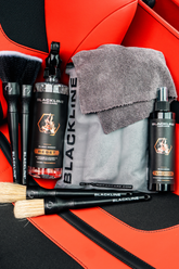 Blackline CAR CARE RESET interior cleaner and scent booster in a Ferrari F12 seat, showcasing the product&