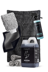 Blackline Car Care BLACKLINE® Ultra Foam car shampoo in a 64oz bottle with dark ice label, showcasing thick foam for vehicle cleaning.