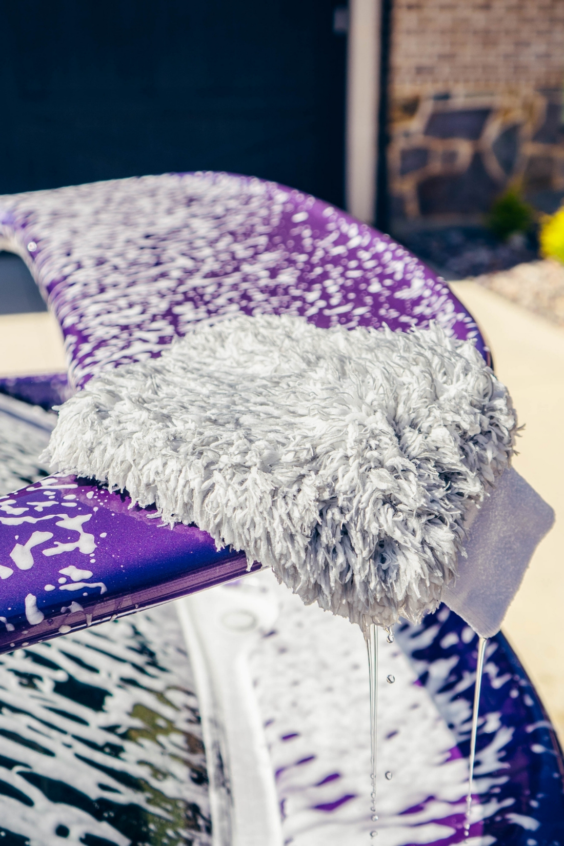 Close-up of Blackline Car Care BLACKLINE® microfiber wash mitt showing soft microfiber material for gentle car washing.