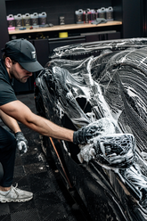Blackline Car Care BLACKLINE® microfiber wash mitt in use, showing soft, plush material designed for gentle vehicle cleaning.