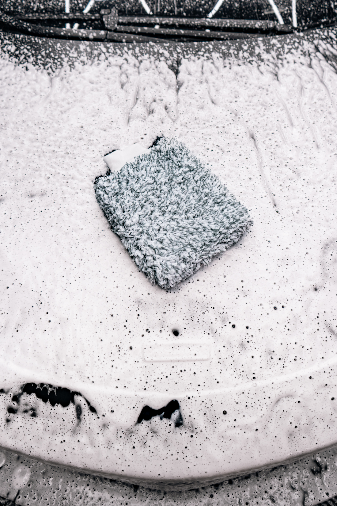 Blackline Car Care BLACKLINE® microfiber wash mitt in use, designed for gentle, effective vehicle cleaning with soft microfiber material.