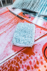 Blackline Car Care BLACKLINE® microfiber wash mitt used for car washing, showing soft microfiber material and flexible design.