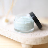 Blue Beauty Cream by Pretty Farm Girl, soothing face cream in a blue jar with a white lid, showcasing its calming skincare formula.