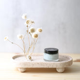 Blue beauty face cream by Pretty Farm Girl in soothing tallow formula, shown in a jar with a smooth blue cream texture.