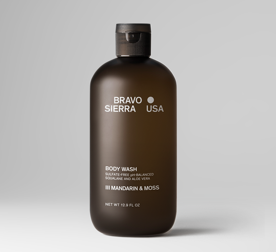 Bottle of Bravo Sierra mandarine body wash with a clear pump dispenser, showcasing the product label and vibrant citrus scent.