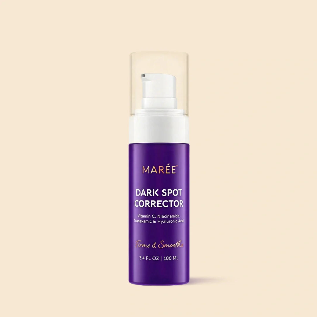 Maree Face &amp; Body Serum for Dark Spots showing the bottle with serum and applicator on a clean surface.