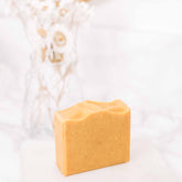 Brightening Vitamin C and Bakuchiol soap bar by Pretty Farm Girl, showing a natural skincare bar with citrus and herbal ingredients.