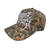 Camo Mayhem Hat by Any Means Necessary Clothing featuring a camouflage fabric and adjustable strap for a casual, streetwear style.