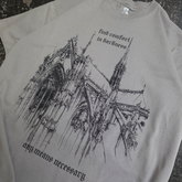 Close-up of a grey Chapel T-Shirt by Any Means Necessary Clothing, showing the front neckline and fabric details.