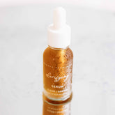 Pretty Farm Girl clarifying face serum for acne-prone skin in a clear glass bottle with dropper applicator.