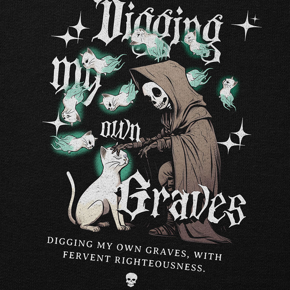 Yūjin Clothing Digging My Own Graves cat hoodie featuring a black hoodie with a graphic design of a cat digging a grave.