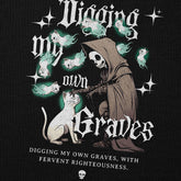 Yūjin Clothing Digging My Own Graves cat hoodie featuring a black hoodie with a graphic design of a cat digging a grave.