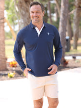 Navy Coast Long Sleeve Polo by White Water Life, featuring a classic collar and button placket, displayed on a hanger.