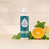Puracy silicone-free conditioner in a 12oz bottle, hydrating hair with natural ingredients, sulfate and dimethicone free.