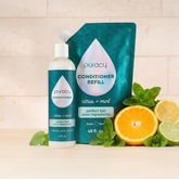 Puracy silicone and sulfate-free conditioner in a 12oz refill bottle, smooths hair with nourishing ingredients.