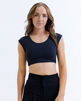 Black Downeast Contour Demi Tee displayed on a hanger, showcasing its soft fabric and relaxed fit.