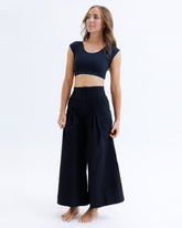 Black Downeast Contour Demi Tee displayed on a hanger, showing its fitted, casual design with short sleeves and a rounded neckline.