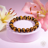 Conscious Items 7A Grade Tiger’s Eye bracelet featuring polished stones and an elastic band for a stylish, natural gemstone jewelry accessory.