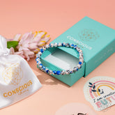 Conscious Items K2 stone bracelet with 6mm beads, featuring spiritual adventure-themed design on a neutral background.