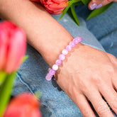 Pink Kunzite bracelet from Conscious Items featuring a delicate string of pink gemstones with a silver clasp.