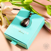 Hypersthene Millionaire Manifestation pendant necklace by Conscious Items featuring a polished stone pendant on a delicate chain.