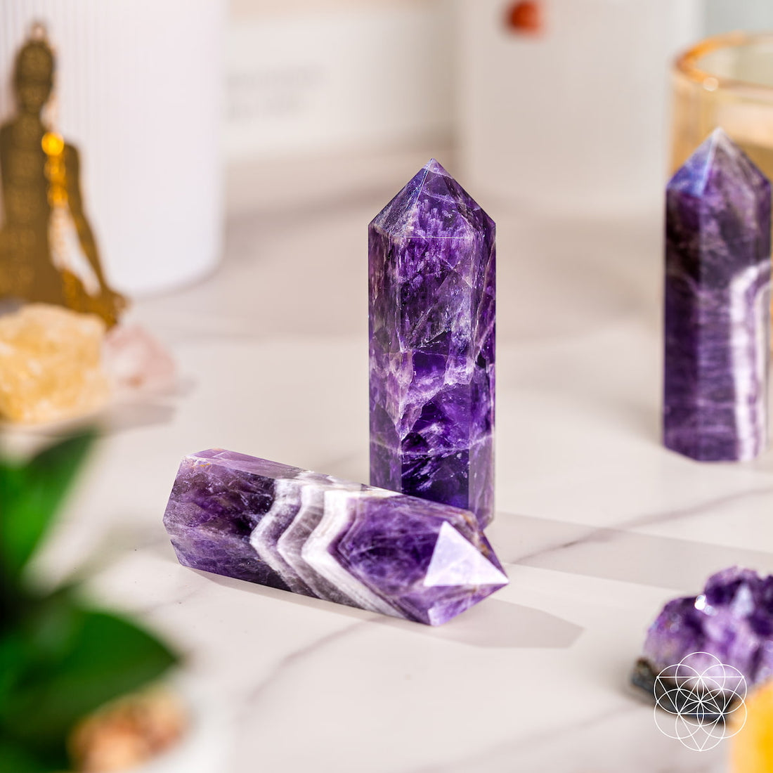 Chevron Amethyst Point of Transformation crystal for home decoration, featuring purple and white banded amethyst on a natural base.