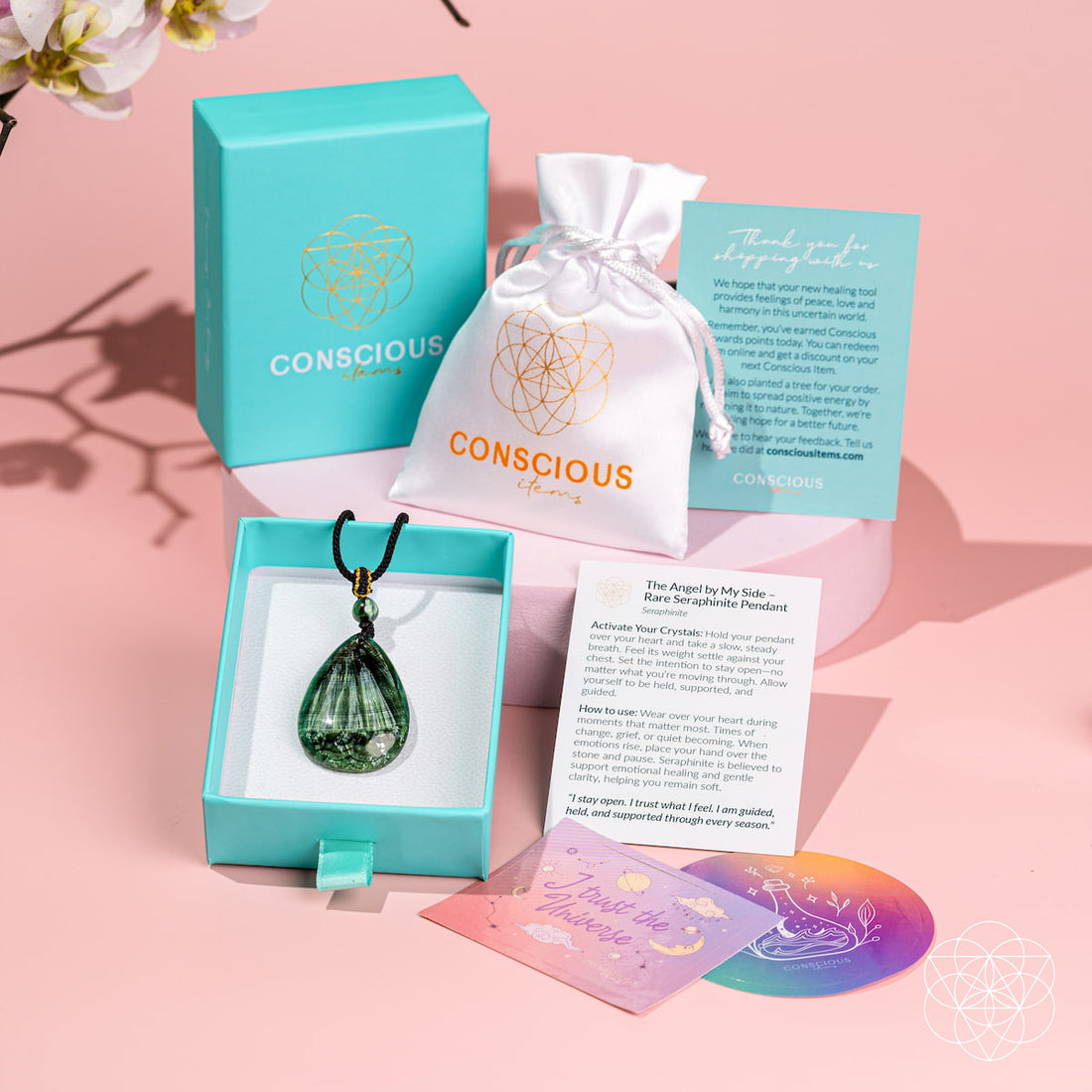Seraphinite pendant necklace called The Angel by My Side from Conscious Items, featuring a polished, green and silver-toned gemstone.