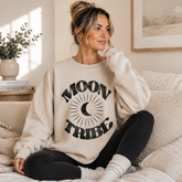 Cozy lunar essence fleece crew sweatshirt with moon tribe graphic in black, featuring soft fabric and relaxed fit from Fitkitty Culture.