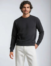 Black fleece crew neck sweatshirt by SpectraUSA, featuring a comfortable fit and classic design for casual wear.