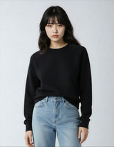 Women’s black fleece crew neck sweatshirt by SpectraUSA, soft and cozy with a classic fit and ribbed cuffs.