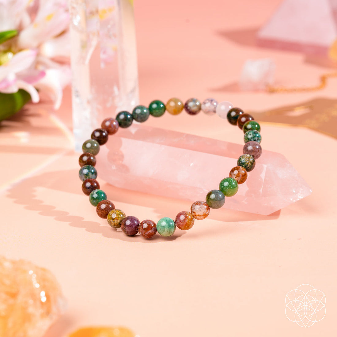 Conscious Items Energy Bracelet with 6mm beads, featuring natural stone and metal accents, worn on the wrist.