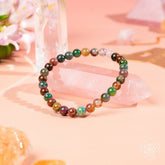 Conscious Items Energy Bracelet with 6mm beads, featuring natural stone and metal accents, worn on the wrist.