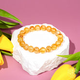Golden Healer Quartz bracelet by Conscious Items featuring polished golden-colored beads on a stretch cord.