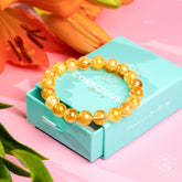 Golden Healer Quartz bracelet by Conscious Items featuring polished golden healing quartz stones on a stretchy band.