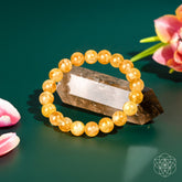 Golden Healer Quartz bracelet from Conscious Items featuring polished golden-hued crystals on a stretchy band.