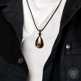 Hypersthene Millionaire Manifestation Pendant necklace by Conscious Items featuring a sleek, polished gemstone pendant on a chain.