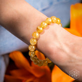 Golden Healer Quartz bracelet from Conscious Items featuring polished golden-colored healing stone beads.